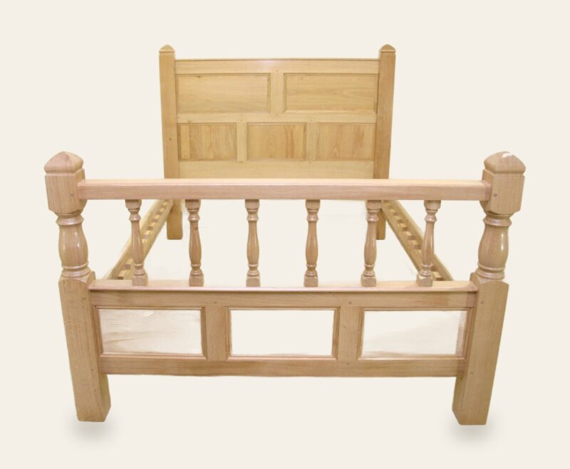 Bed with turned foot board end view — handmade by Bryn Hall in Suffolk