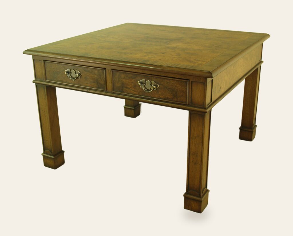 A burr walnut coffee table seen from an angle