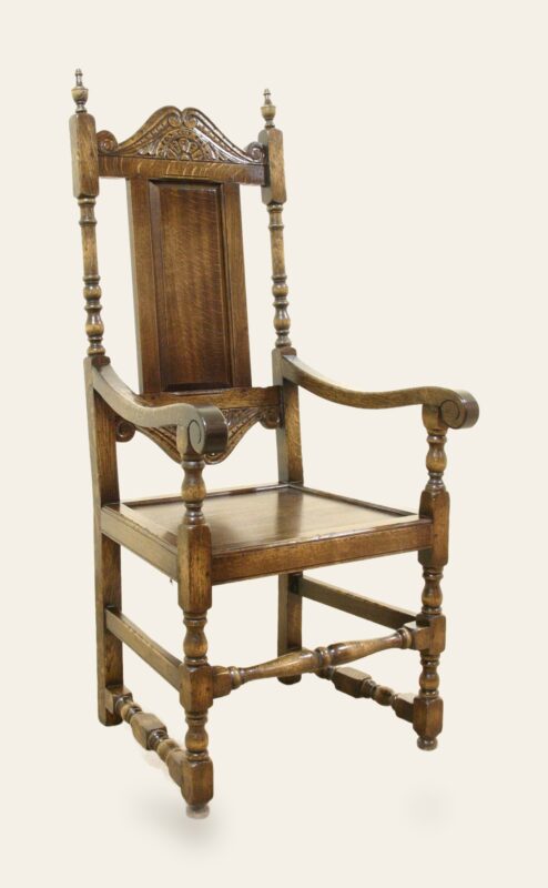 Carved panel back carver chair 525, angle view — handmade by Bryn Hall in Suffolk