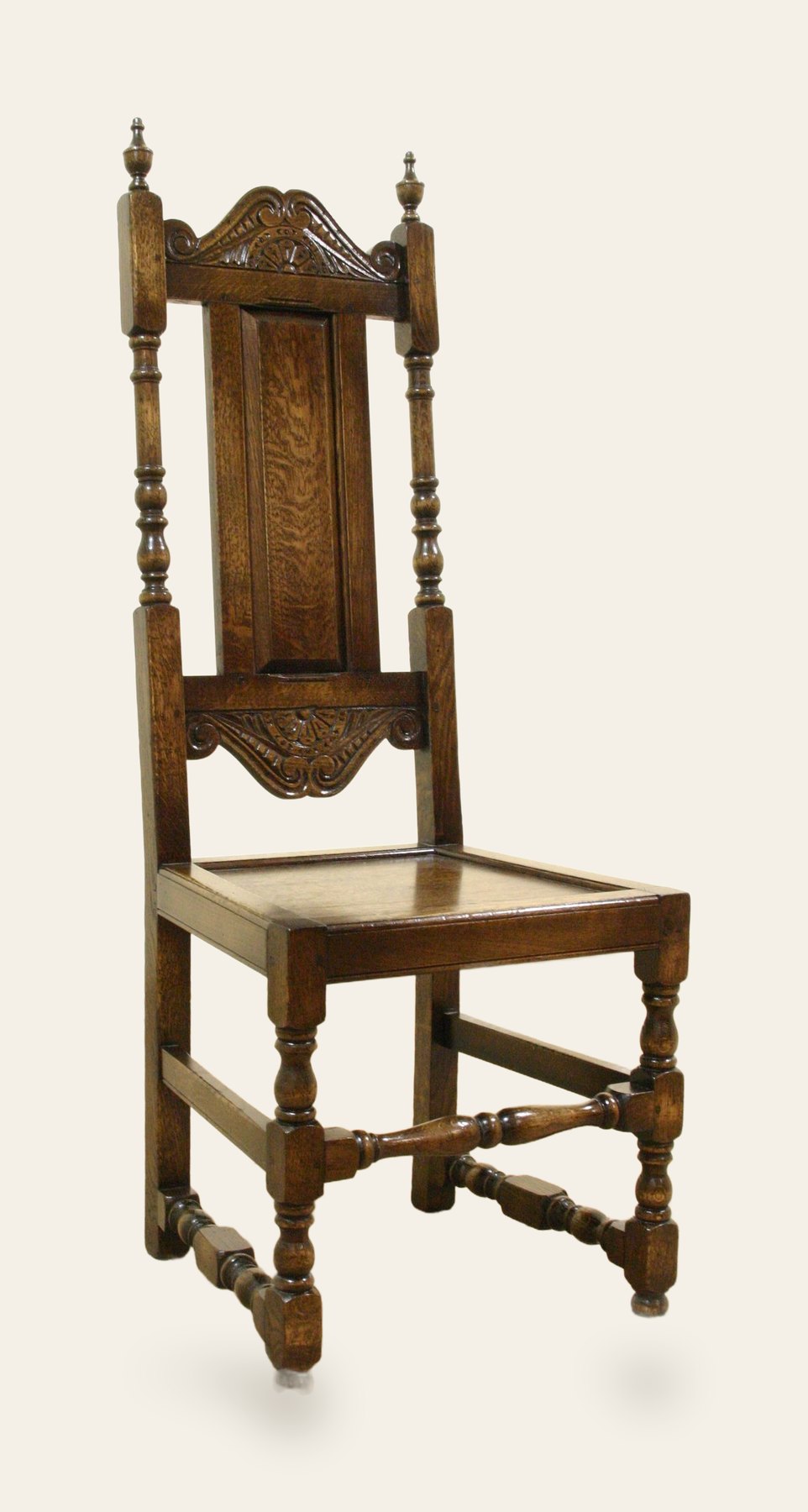 Carved panel back single chair 524, angle view — handmade by Bryn Hall in Suffolk