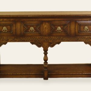 Carved potboard base with four drawers, front view — handmade by Bryn Hall in Suffolk