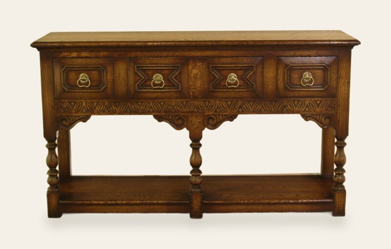 Carved potboard base with four drawers, front view — handmade by Bryn Hall in Suffolk