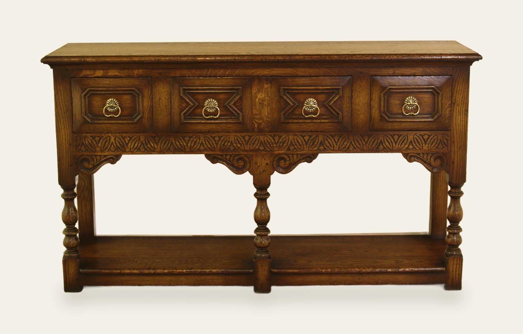 Carved potboard base with four drawers, front view — handmade by Bryn Hall in Suffolk