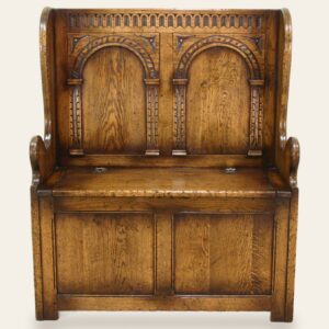 Carved settle, front view — handmade by Bryn Hall in Suffolk
