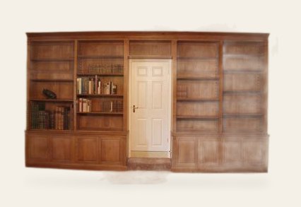 Fitted bookcase with door in the middle — handmade by Bryn Hall in Suffolk