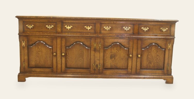 Four door drawer dresser base shaped fielded doors, front view — handmade by Bryn Hall in Suffolk