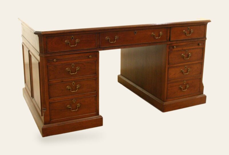 Pedestal desk 901 in cherry, angle view — handmade by Bryn Hall in Suffolk