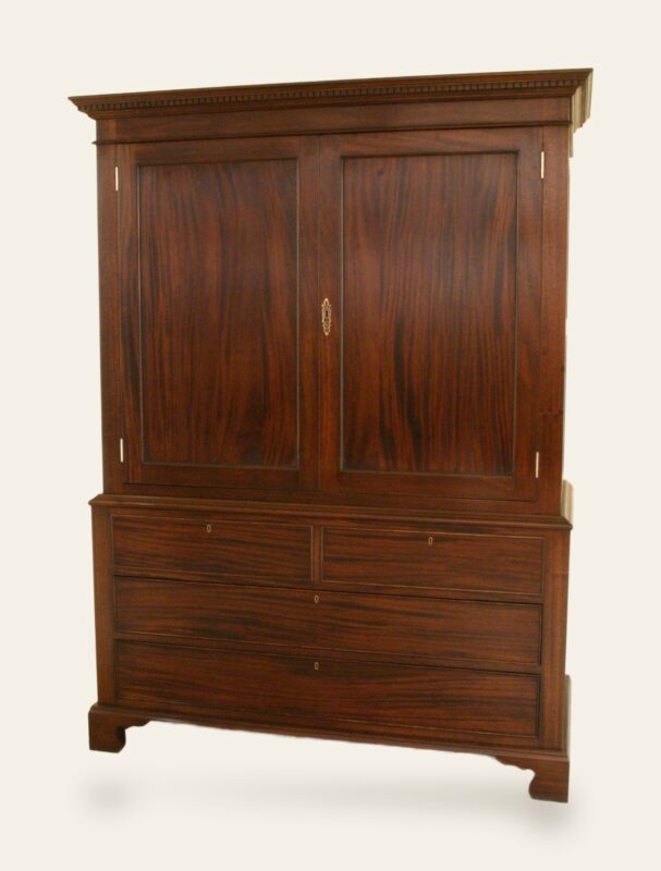 Press cupboard in mahogany, angle view — handmade by Bryn Hall in Suffolk
