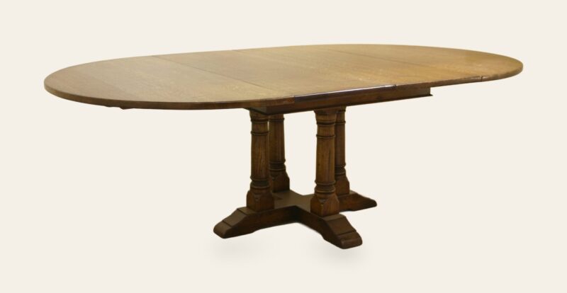 Round cross stretcher monks table 344 leave in, angle view — handmade by Bryn Hall in Suffolk