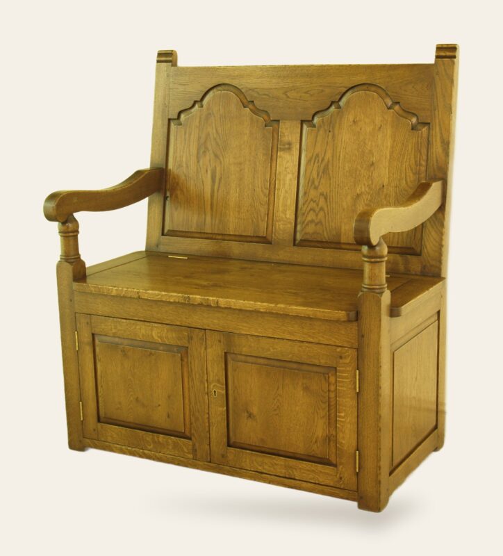Settle with door, angle view — handmade by Bryn Hall in Suffolk