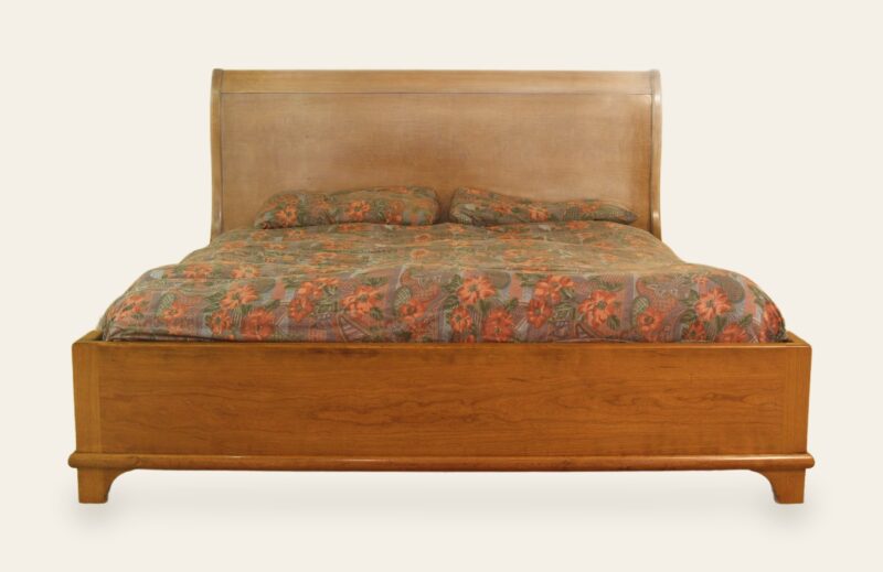 Sleigh bed, front view — handmade by Bryn Hall in Suffolk