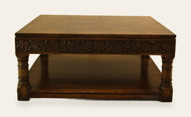 Square grape carved coffee table, front view — handmade by Bryn Hall in Suffolk