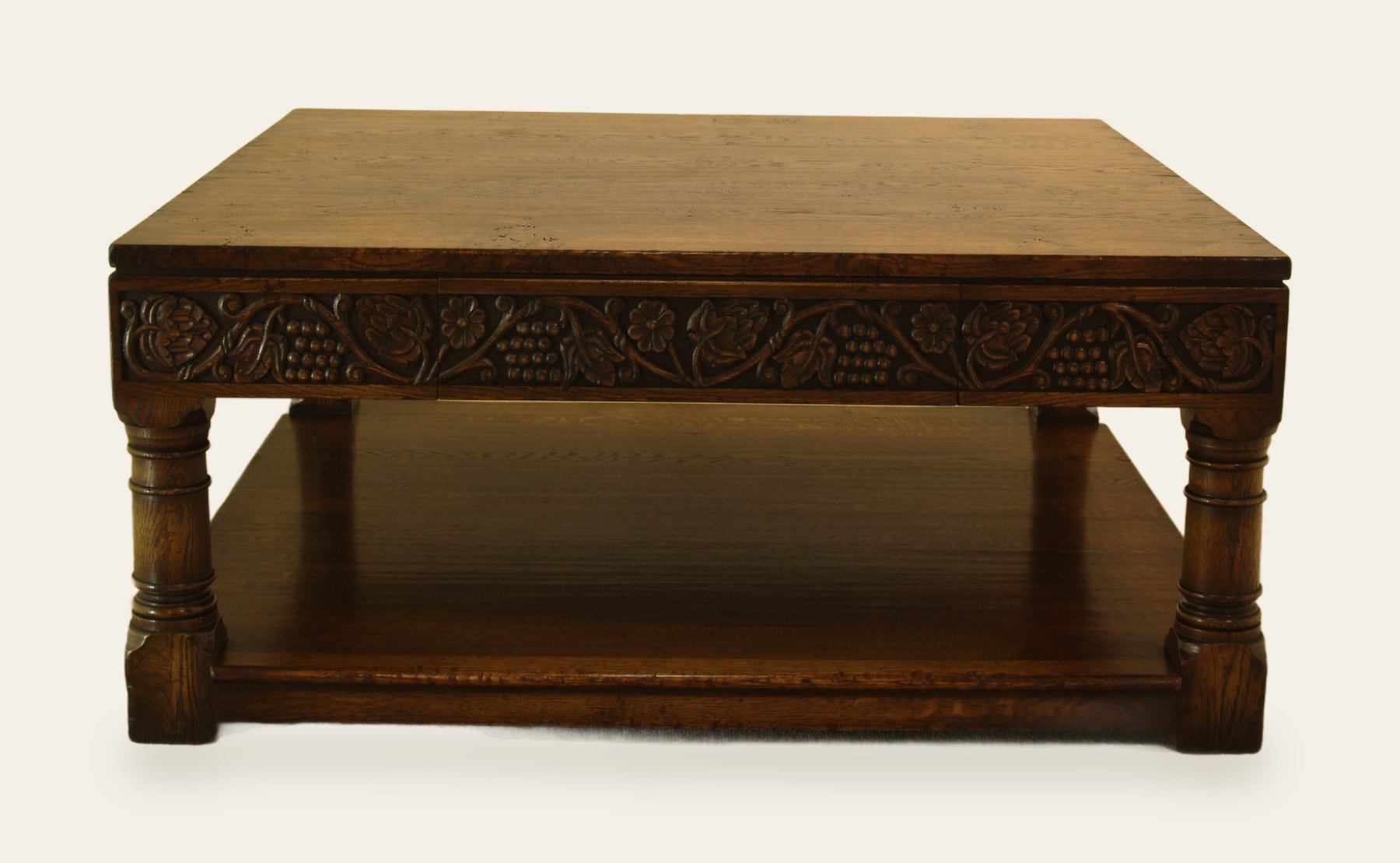 Square grape carved coffee table, front view — handmade by Bryn Hall in Suffolk