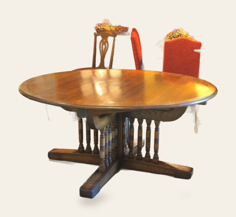 Table with burr oak in top 20 turned legs — handmade by Bryn Hall in Suffolk