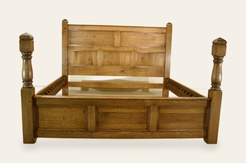 Turned and panelled bed, front view — handmade by Bryn Hall in Suffolk