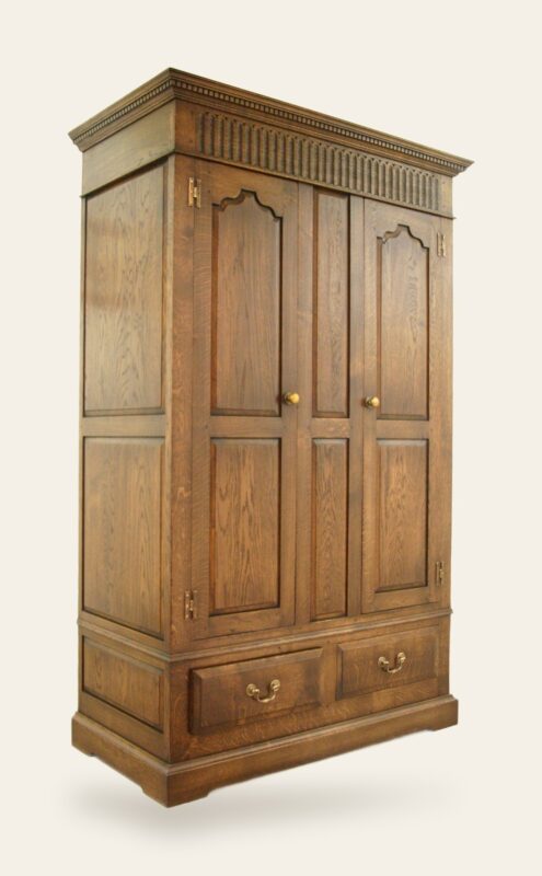 Two door carved wardrobe 931, angle view — handmade by Bryn Hall in Suffolk