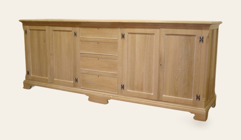 Windrush dresser base four doors and row of four drawers limed oak, angle view — handmade by Bryn Hall in Suffolk