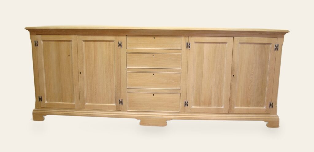 Windrush dresser base four doors and row of four drawers limed oak, front view — handmade by Bryn Hall in Suffolk