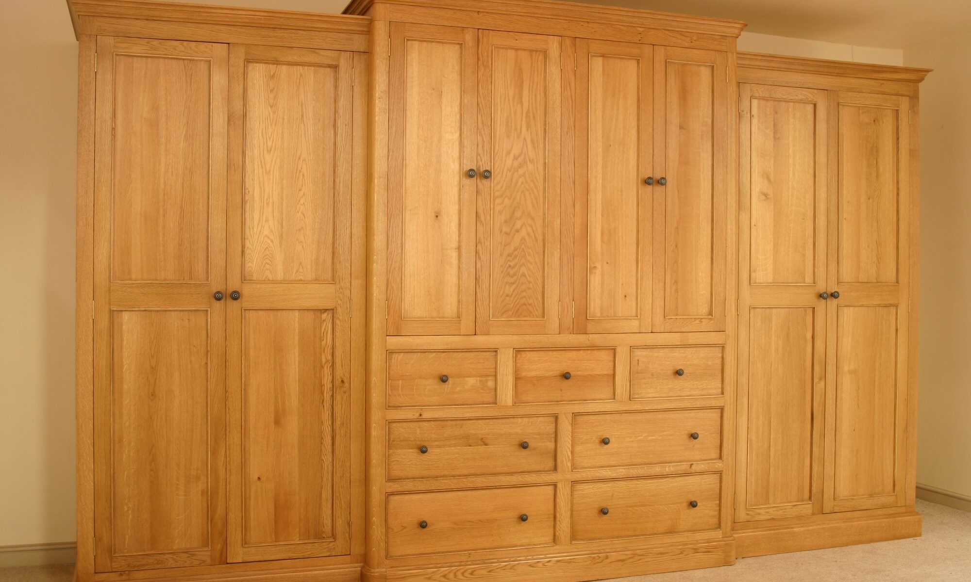 Large brakefront wardrobe 8 doors and 7 drawers, view 1 — handmade by Bryn Hall in Suffolk