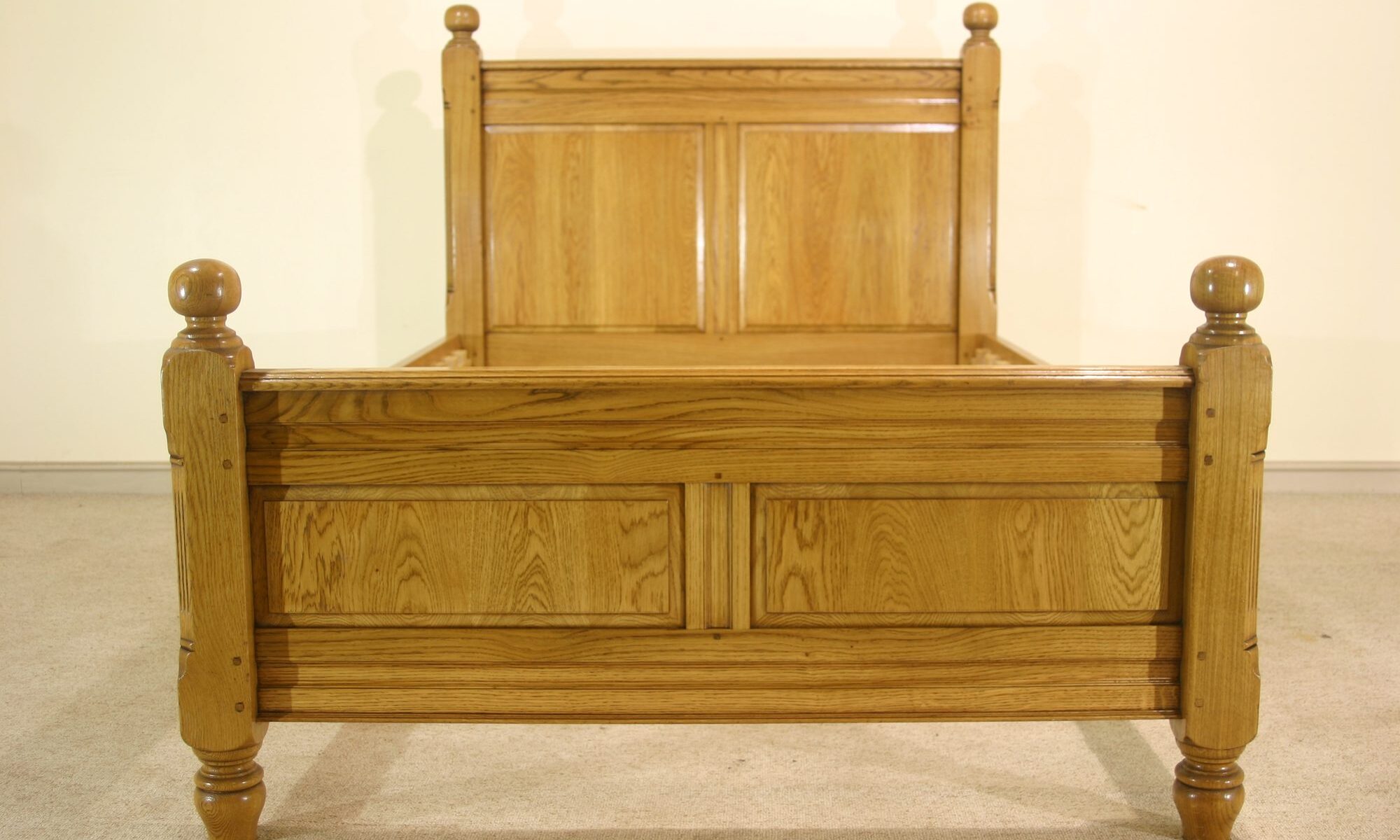 Paneled bed 928, front view — handmade by Bryn Hall in Suffolk