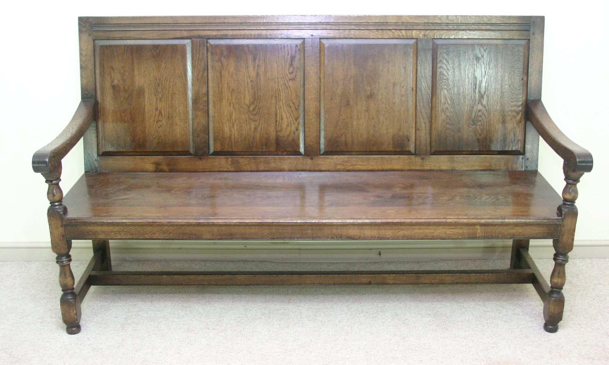 Panelled bench settle 971, front view — handmade by Bryn Hall in Suffolk