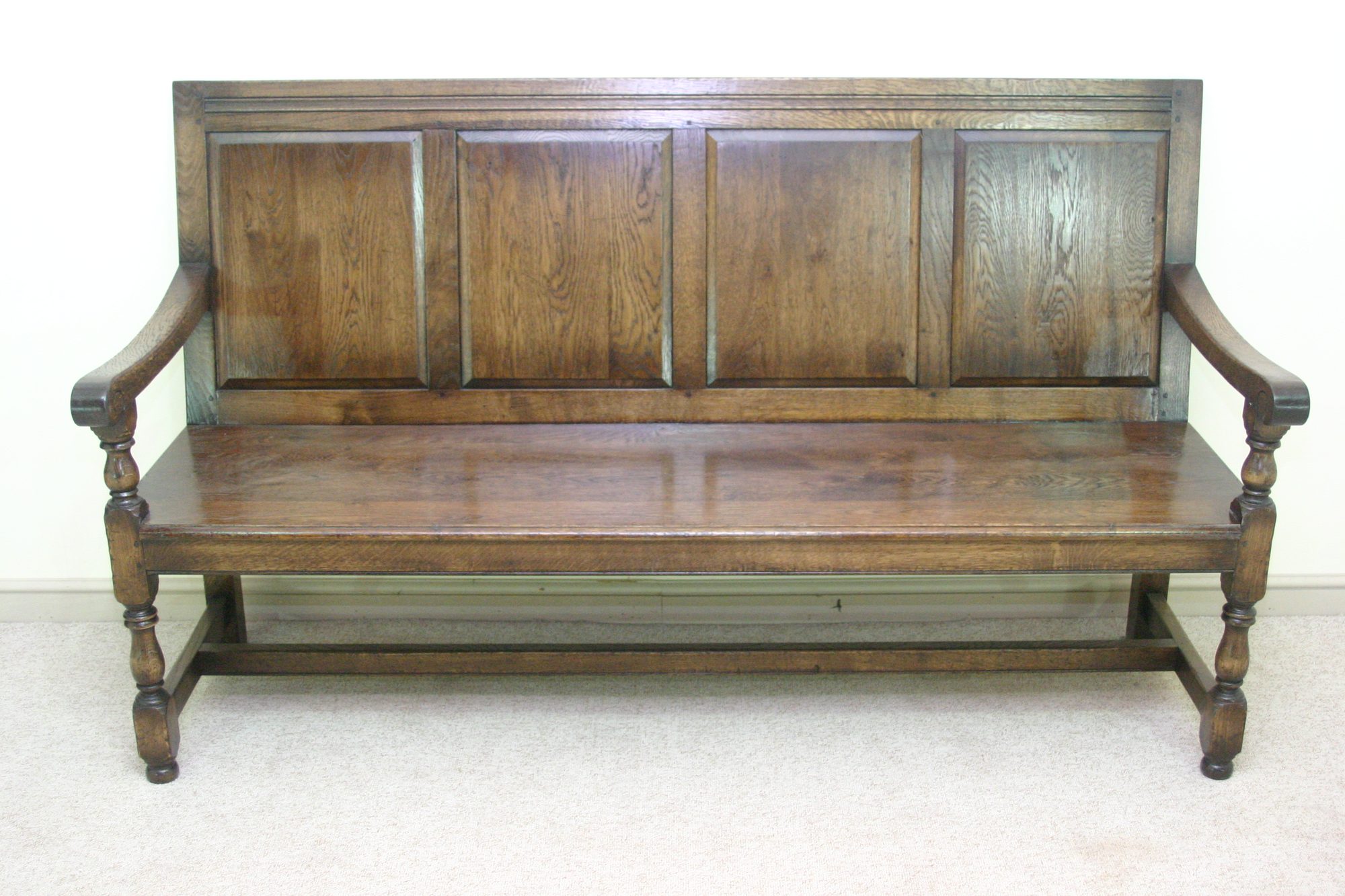 Panelled bench settle 971, front view — handmade by Bryn Hall in Suffolk