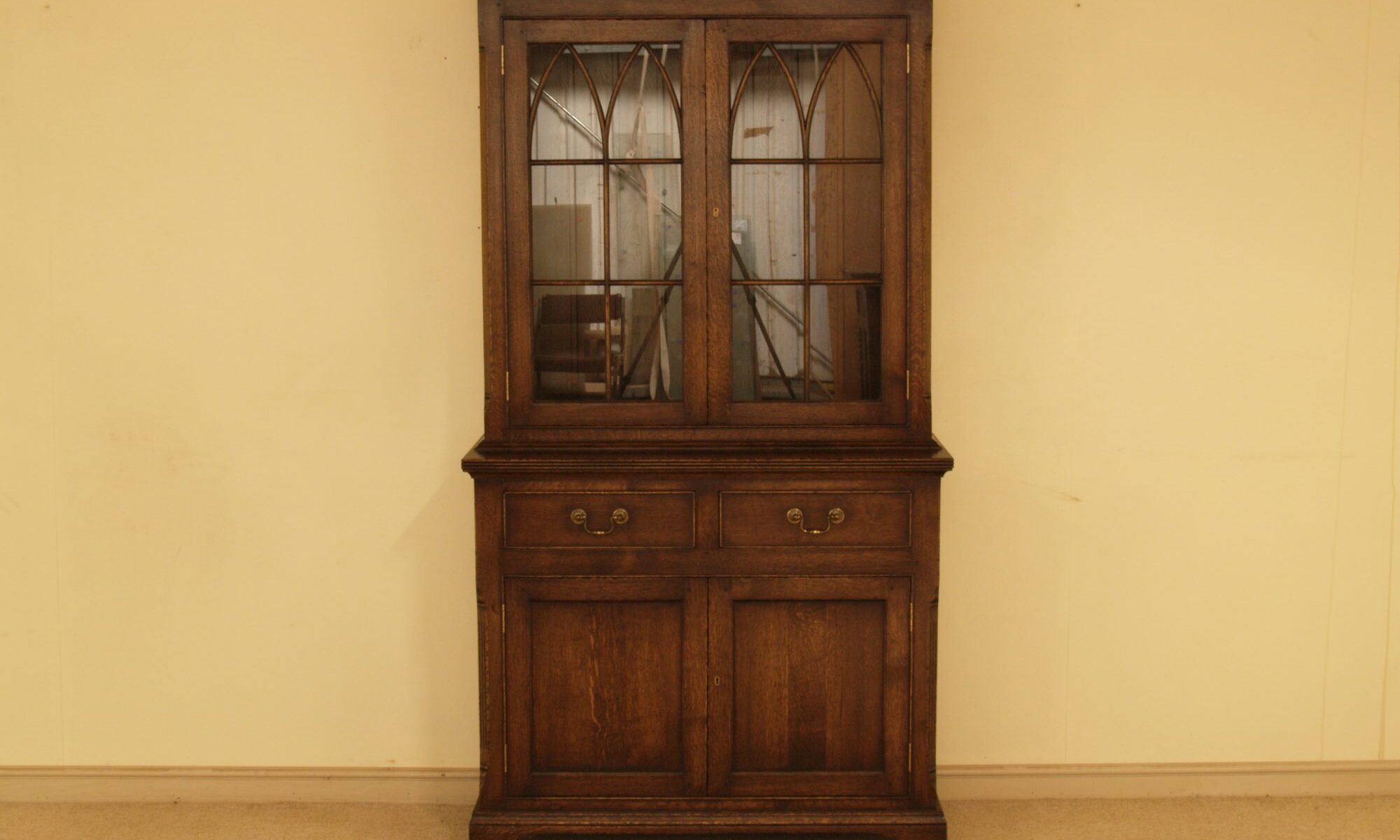 Glazed two door cabinet, front view — handmade by Bryn Hall in Suffolk