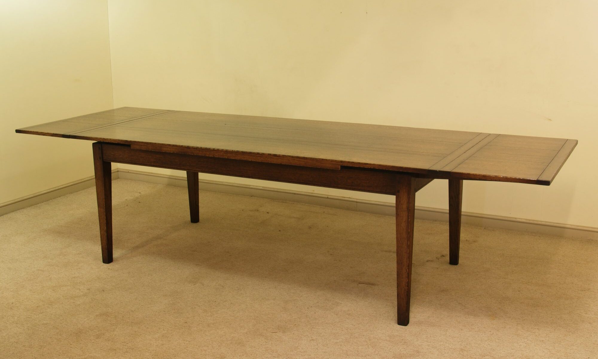 Farm house drawleaf table, angle view both leaves out — handmade by Bryn Hall in Suffolk
