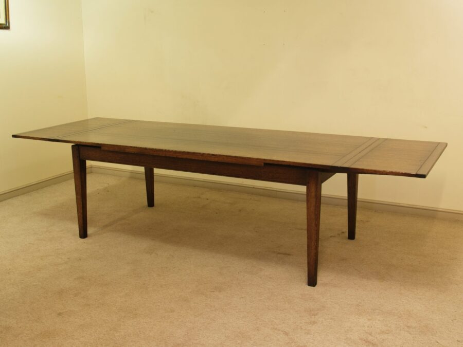 Farm house drawleaf table, angle view both leaves out — handmade by Bryn Hall in Suffolk