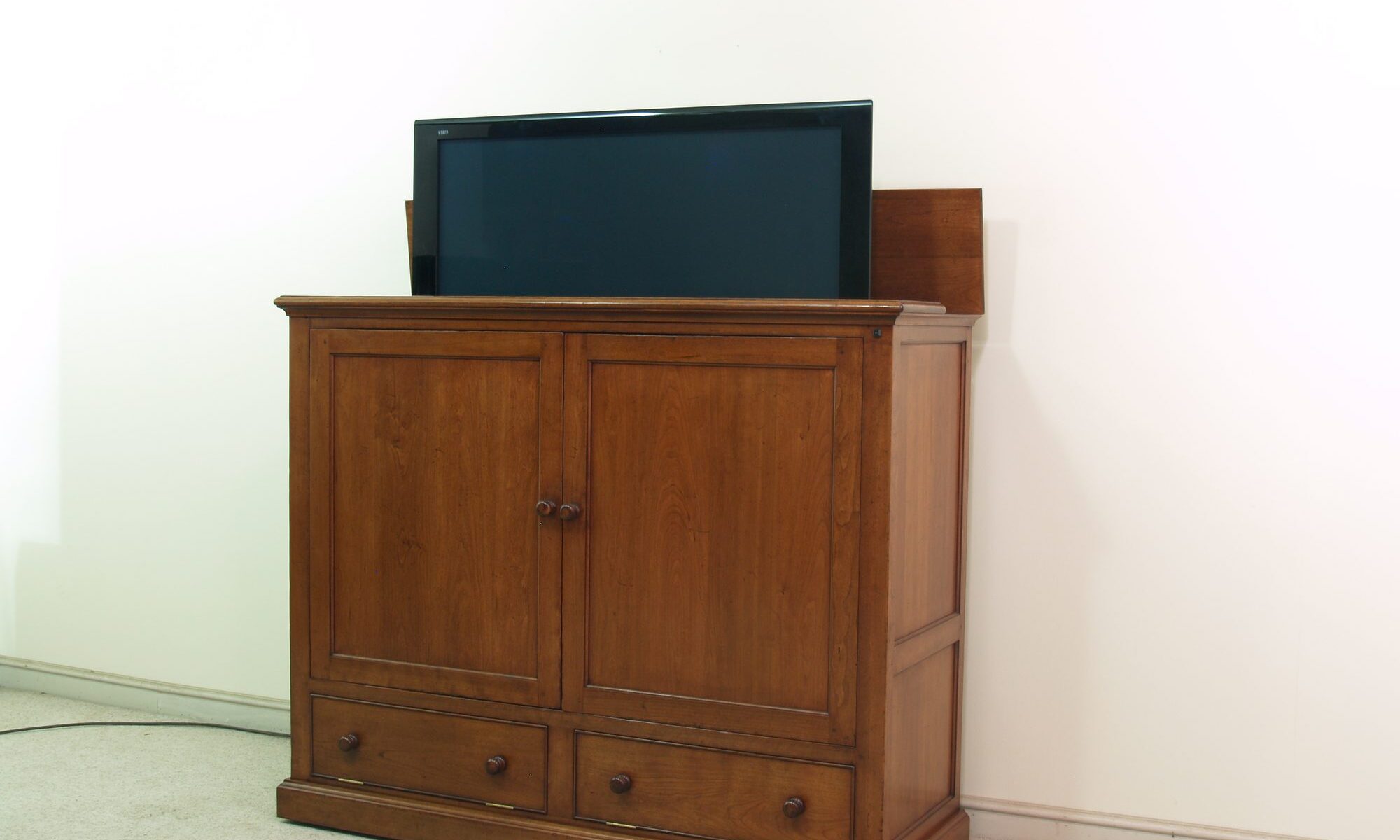 Cherry rise and fall tv lift — handmade by Bryn Hall in Suffolk